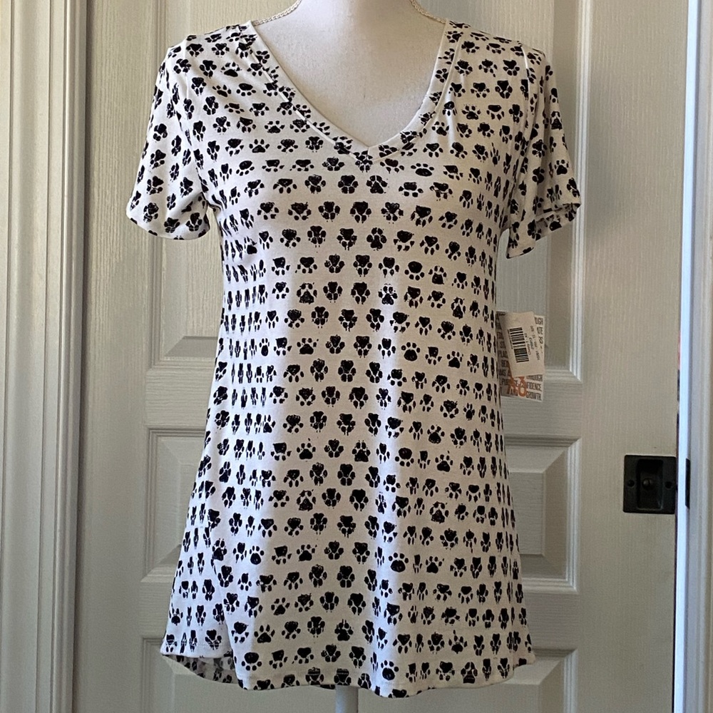 New with tags Lularoe Christy, V-neck T-shirt. White with black paw prints.  XS